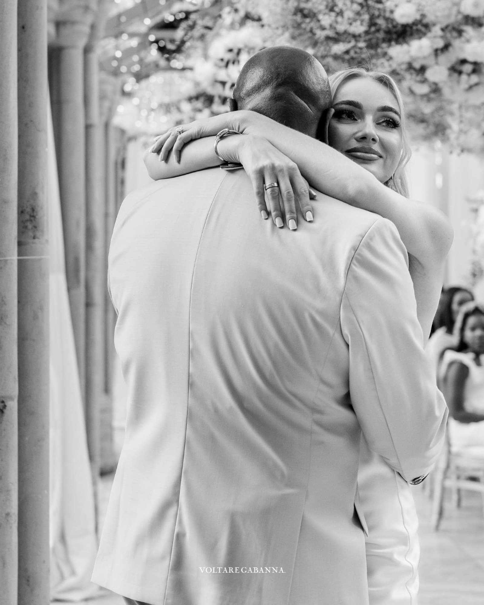 Guests laughing at wedding reception, candid photography