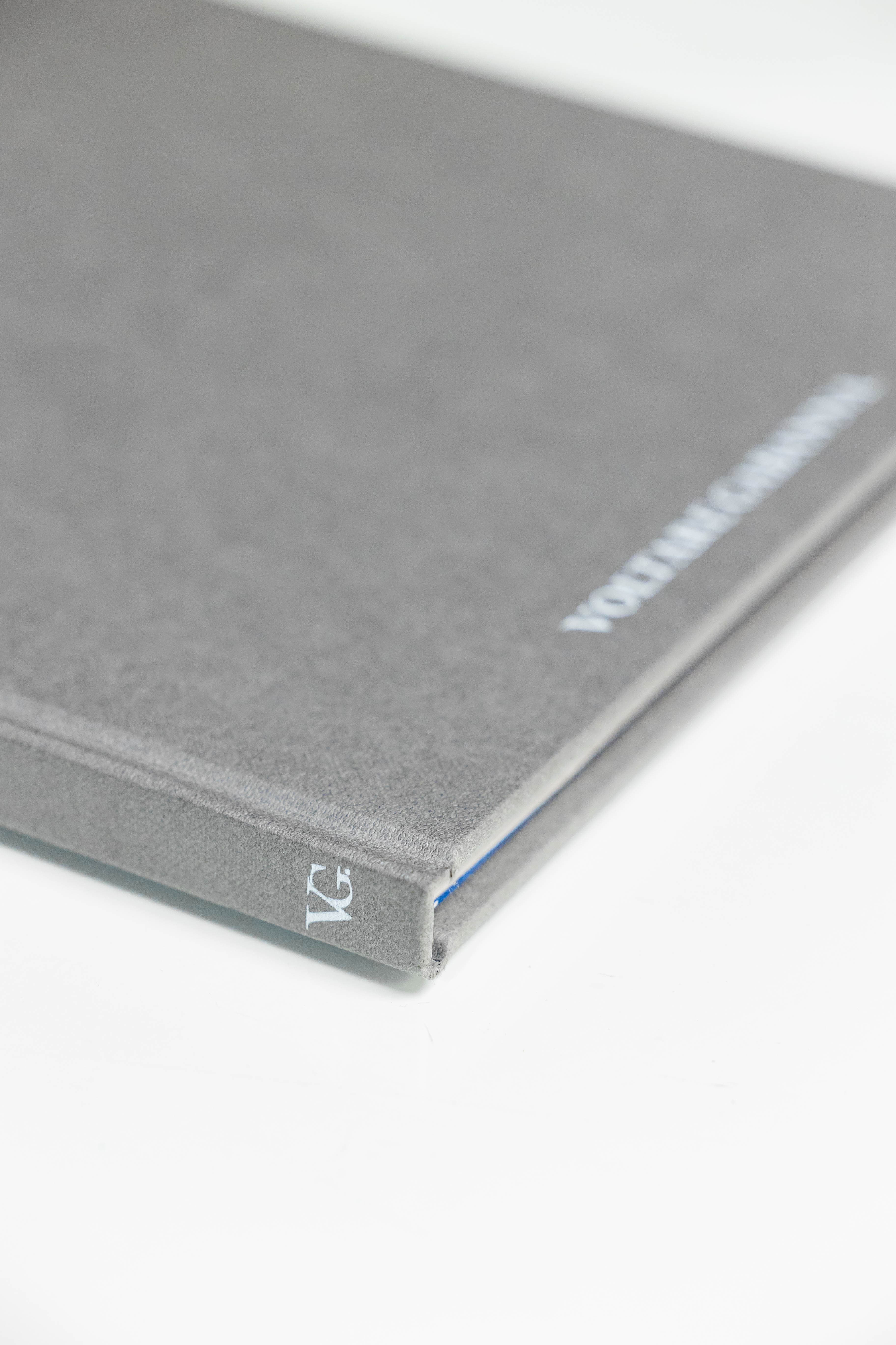 Close-up of dove grey linen cover and spine